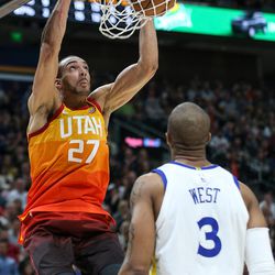 Utah Jazz center Rudy Gobert (27) dunks over Golden State Warriors forward David West (3) at Vivint Arena in Salt Lake City on Tuesday, Jan. 30, 2018.