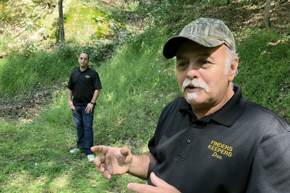Dennis Parada (right) and his son Kem Parada at the site of the FBI’s dig for Civil War-era gold in Dents Run, Pa.