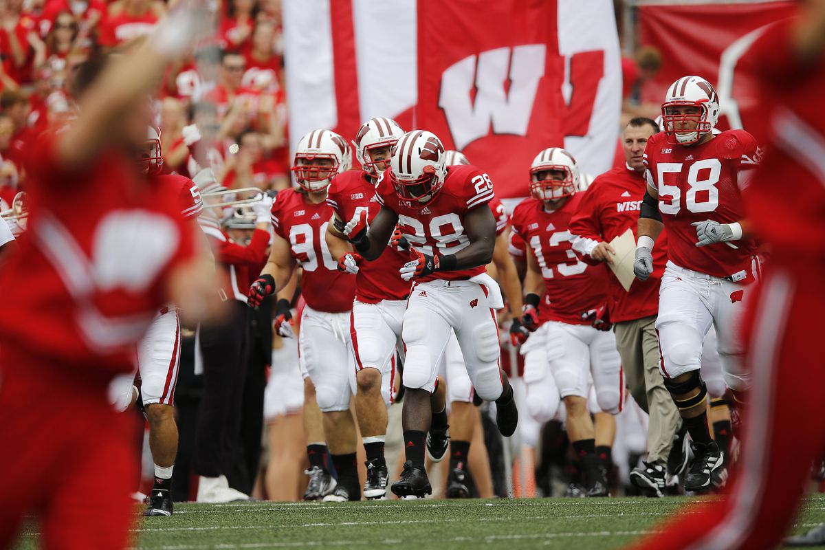 Montee Ball leads the Badgers onto the field to face the Northern Iowa Panthers at Camp Randall Stadium.