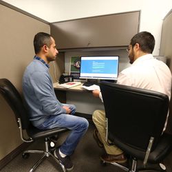 Laith Hasnawi, left, talks with Luis Rois, a navigator at the Utah Health Policy Project, about his options for health care plans in West Valley City on Wednesday, Dec. 14, 2016.