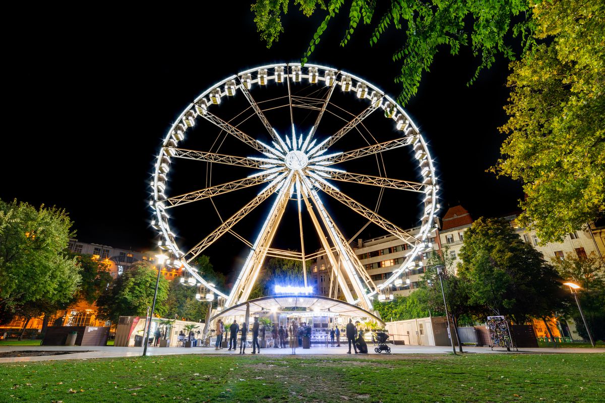 Budapest Eye (ferris wheel) at Erzsebet Square. Luminous Ferris wheel in night city. Budapest Eye at night. 