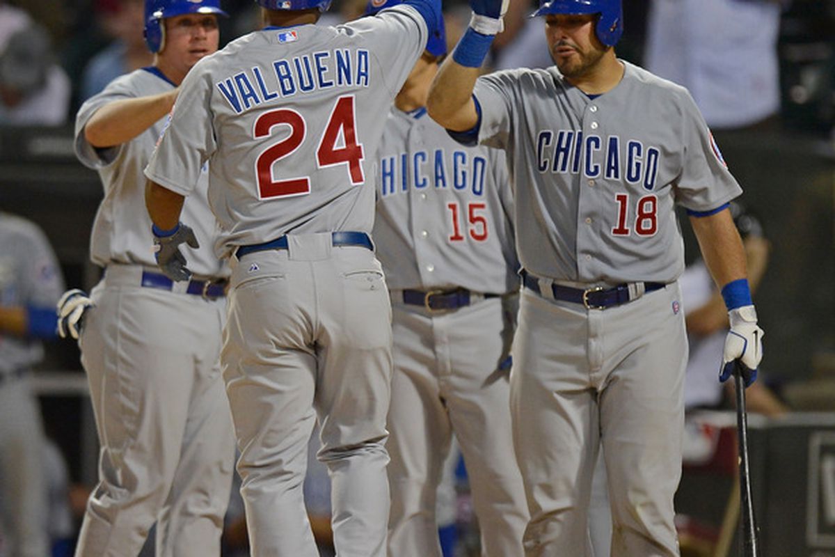 Luis Valbuena of the Chicago Cubs is greeted by Geovany Soto after hitting a three-run home run against the Chicago White Sox at U.S. Cellular Field in Chicago, Illinois.  (Photo by Jonathan Daniel/Getty Images)