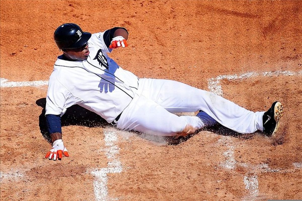 Mar. 5, 2012; Lakeland, FL, USA; Detroit Tigers left fielder Delmon Young (21) slides safely into home to score a run against the Toronto Blue Jays at Joker Marchant Stadium. Mandatory Credit: Andrew Weber-US PRESSWIRE