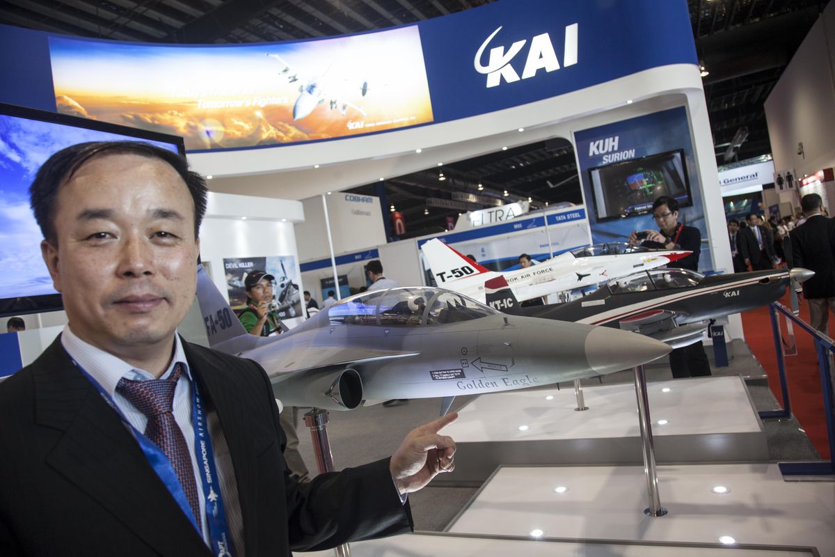 A man touch model of FA-50 by Korea Aerospace Industries is displayed at the Singapore Airshow on February 13, 2014 in Singapore.