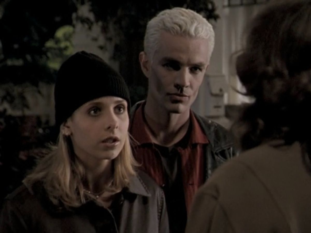 Buffy and Spike standing next to each other.