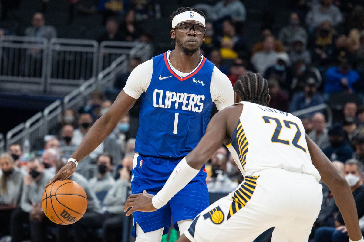 LA Clippers guard Reggie Jackson (1) dribbles the ball while Indiana Pacers guard Caris LeVert (22) defends in the second half at Gainbridge Fieldhouse.