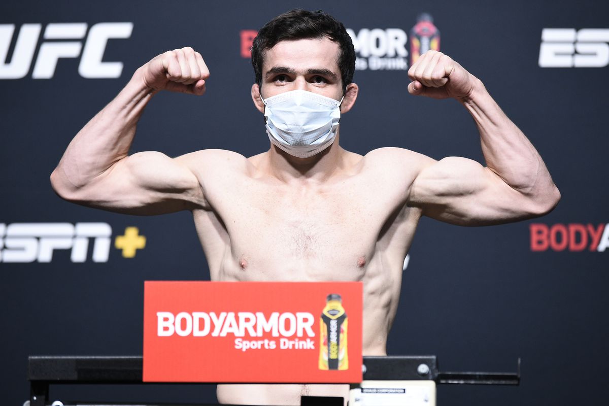 Timur Valiev of Russa poses on the scale during the UFC Fight Night weigh-in at UFC APEX on August 21, 2020 in Las Vegas, Nevada.