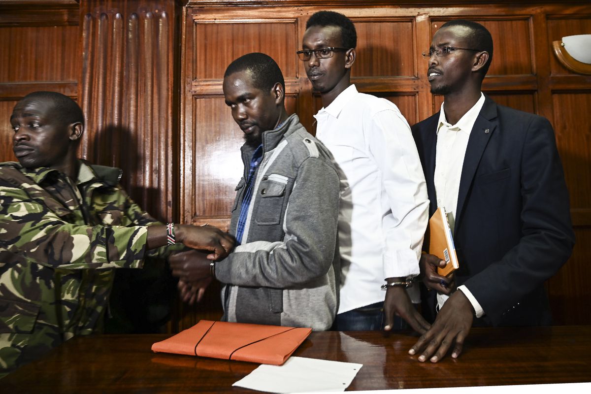 Mohamed Ahmed Abdi, Adan Mohamed Ibrahim and Hussein Hassan Mustafah (left to right) appear at the Milimani High Court in Nairobi, on January 14, 2019, in connection with the Westgate mall terror attack in 2013.