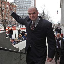 This Feb. 28, 2011 file photo, shows environmental activist Tim DeChristopher waving to supporters at the Frank E. Moss Federal Courthouse in Salt Lake City. 