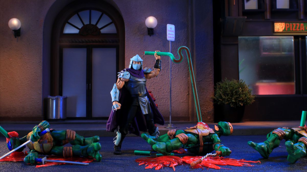 shredder sucks the blood out of michelangelo as leonardo and the other turtles bleed out around him