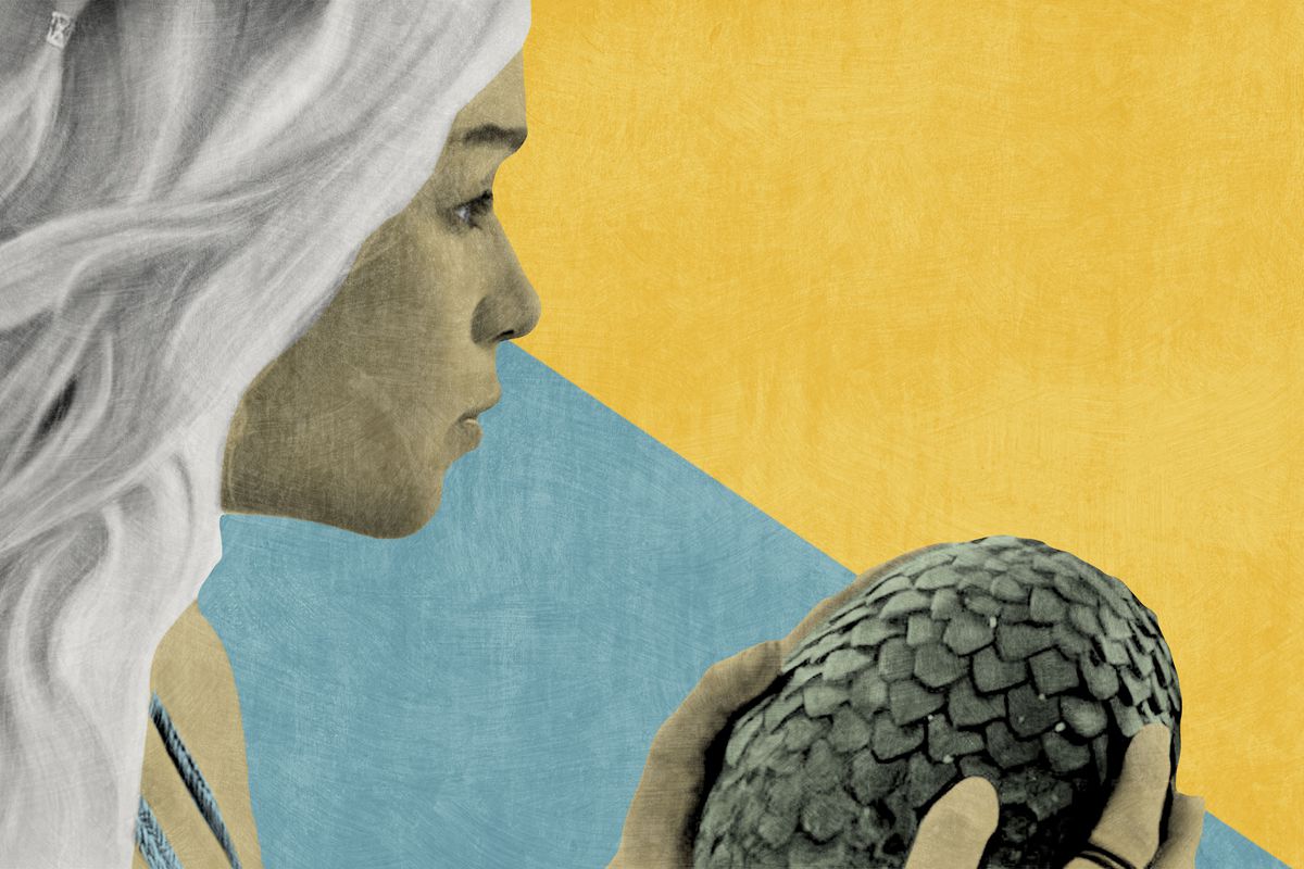 Daenerys Targaryen holding a dragon egg