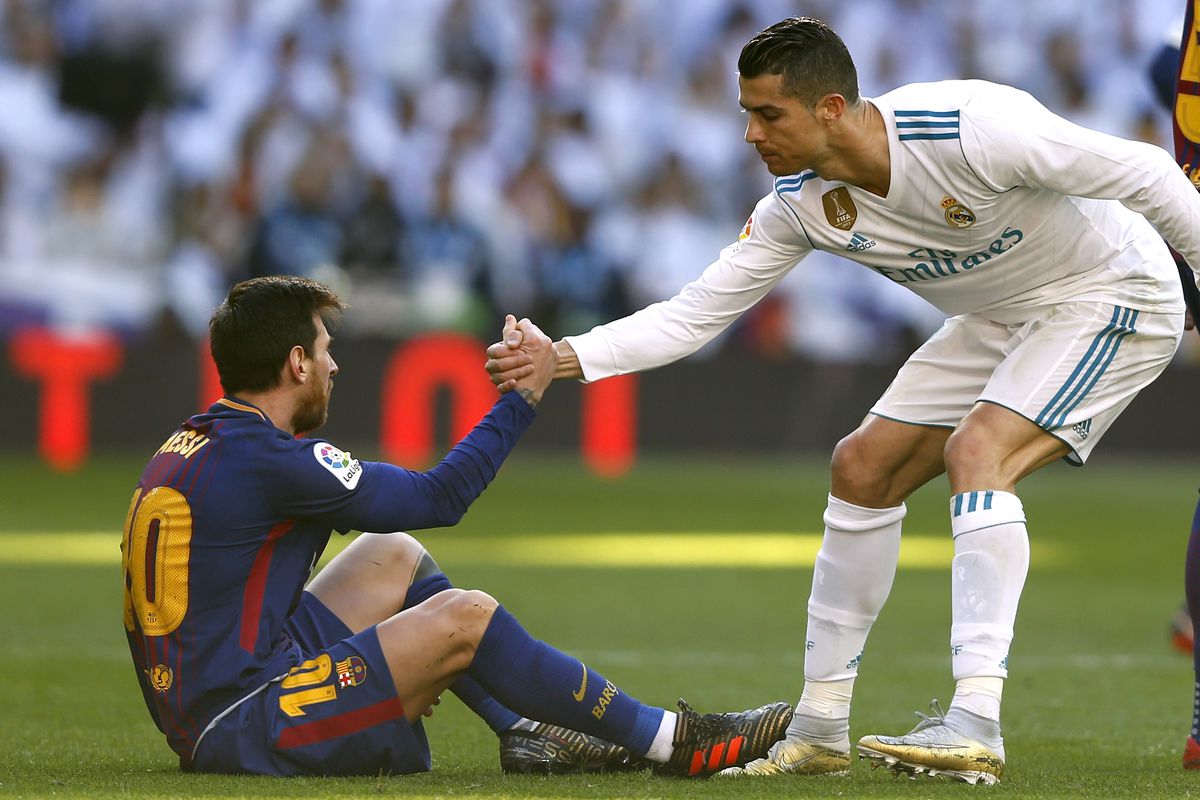 Cristiano Ronaldo helps Lionel Messi - Real Madrid v Barcelona - La Liga