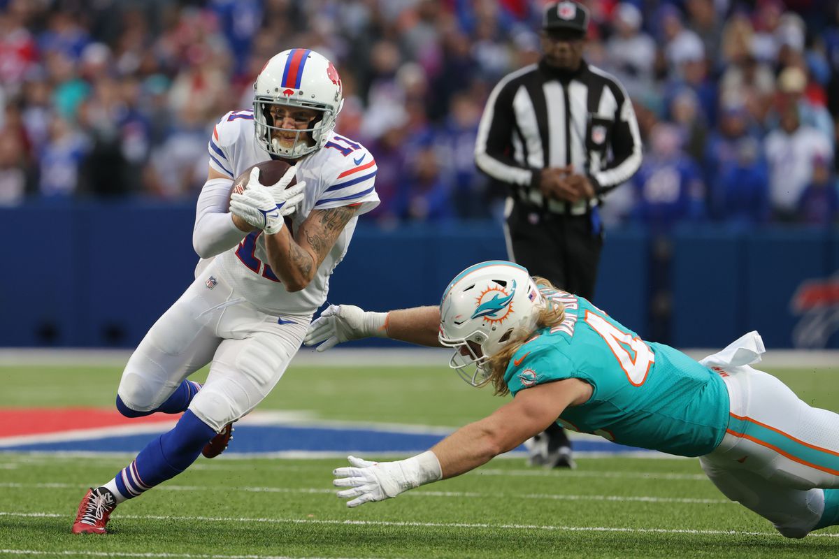 Cole Beasley #11 of the Buffalo Bills runs the ball after a catch against the Miami Dolphins at Highmark Stadium on October 31, 2021 in Orchard Park, New York.