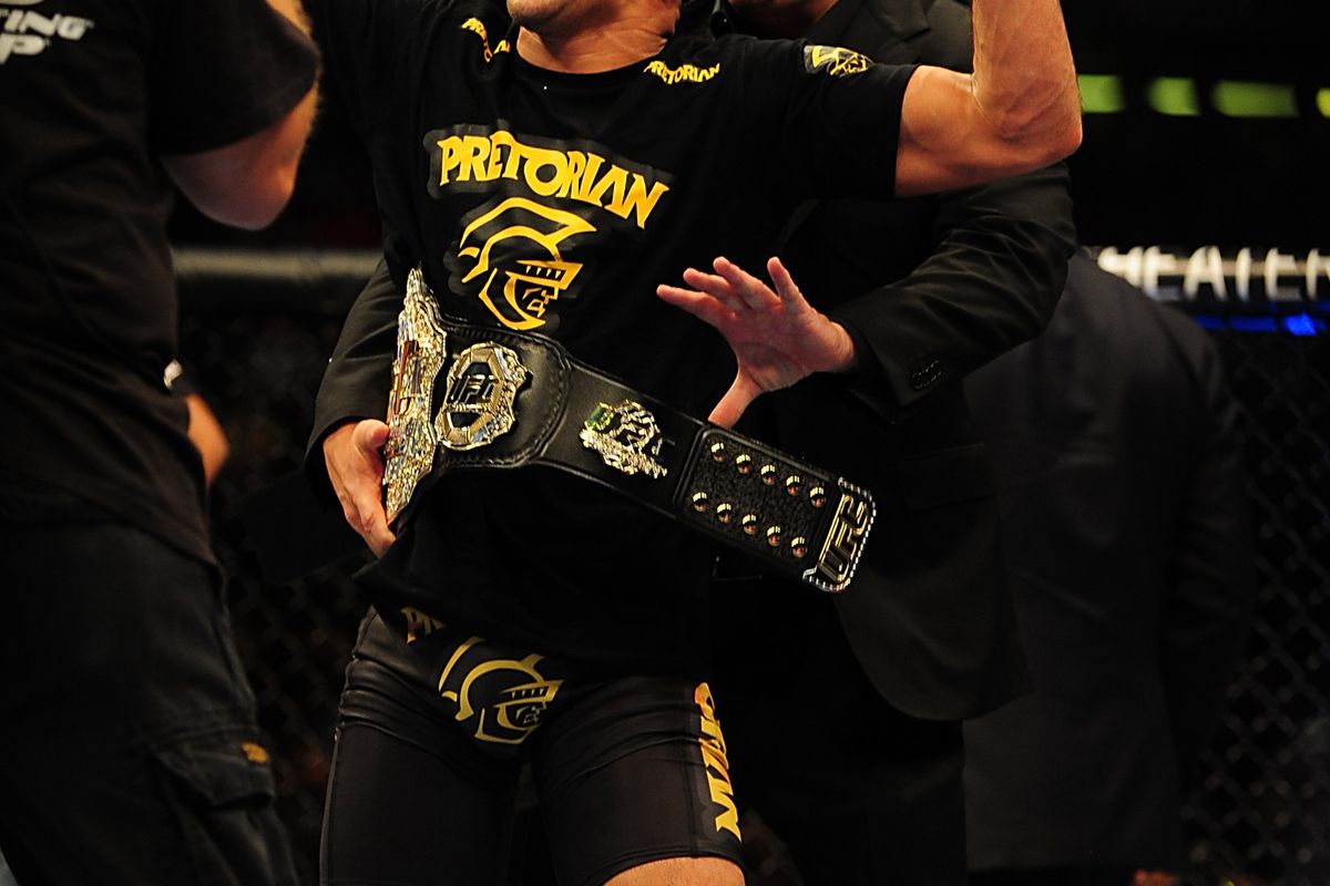 Jul 21, 2012; Calgary, AB, CANADA; Renan Barao celebrates defeating Urijah Faber (not pictured) in the interim bantamweight title bout of UFC 149 at the Scotiabank Saddledome. Mandatory Credit: Anne-Marie Sorvin-US PRESSWIRE