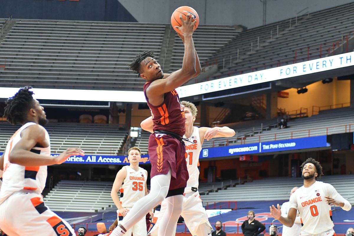 Virginia Tech Hokies forward Justyn Mutts grabs a rebound against the Syracuse Orange in the second half at the Carrier Dome.