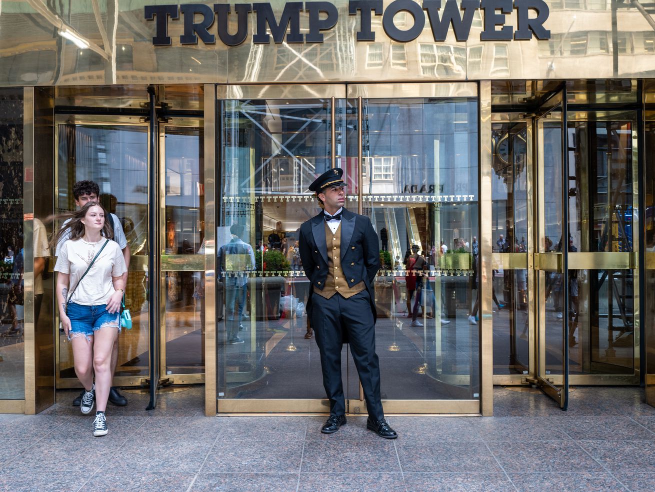People walk out of Trump Tower in Manhattan on August 10, 2022 in New York City.