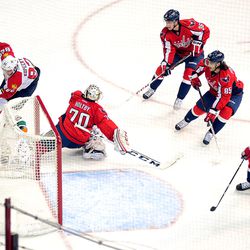 Kopecky With Puck Behind Holtby