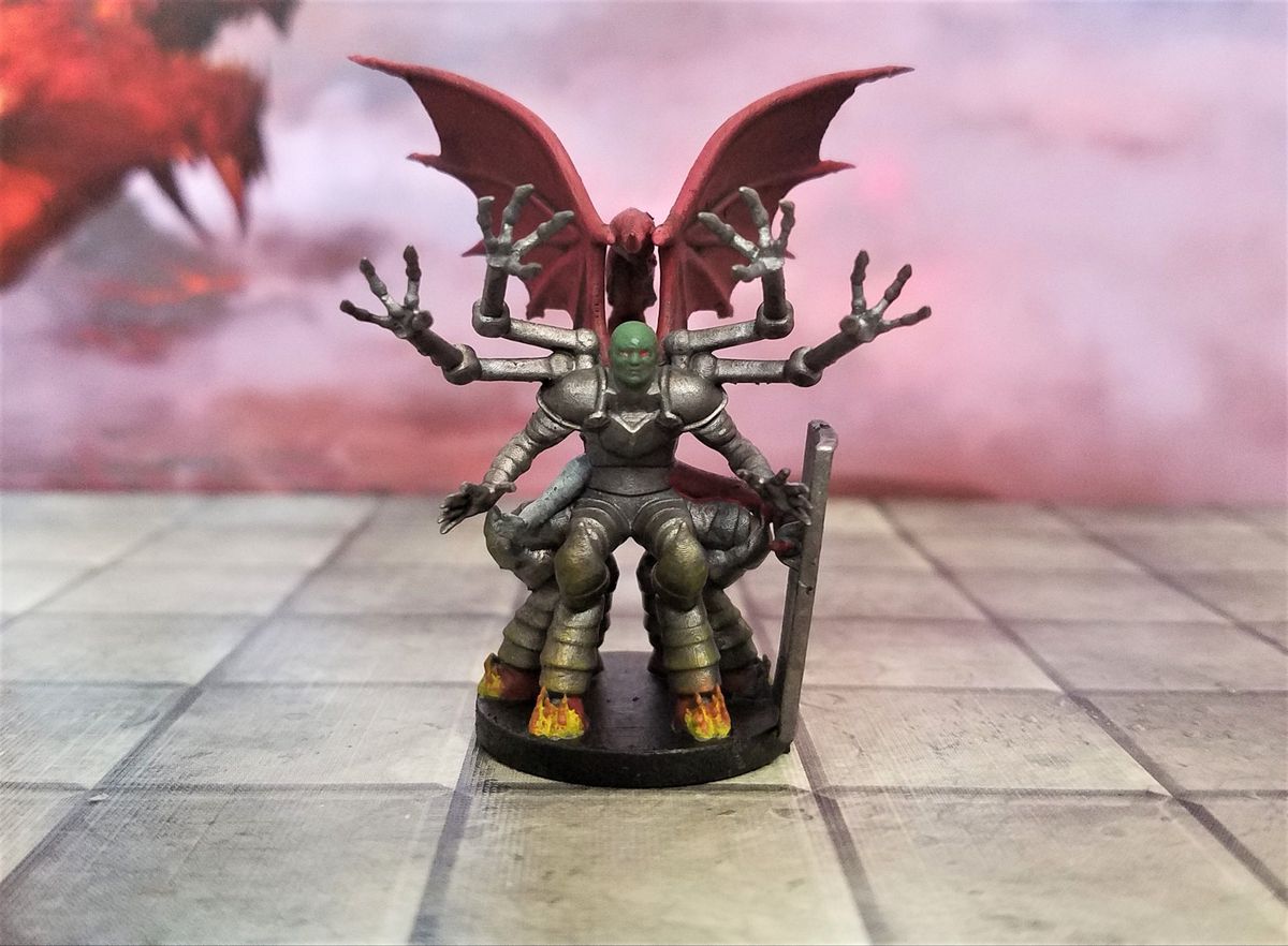 A bald, green-faced demon wearing silver armor. He had red wings, and his six hooves are all on fire.