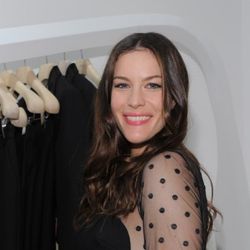 Liv Tyler strikes a pose in the shop, wearing a Stella dress, of course.