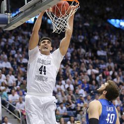 Brigham Young Cougars center Corbin Kaufusi (44) hammers down a dunk over Creighton Bluejays forward Zach Hanson (40) as BYU and Creighton play in NIT quarterfinal action at the Marriott Center in Provo Tuesday, March 22, 2016.