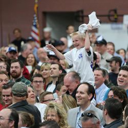 A young boy catches a T-shirt at a rally in Draper at the American Preparatory Academy Saturday, March 19, 2016.