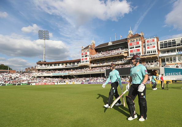 LONDON, ENGLAND - JULY 14: Aaron Finch and Jason Roy of Surrey walk out onto the pitch to bat during the NatWest T20 Blast match between Surrey and Kent at The Kia Oval on July 14, 2017 in London, England. (Photo by Christopher Lee/Getty Images)