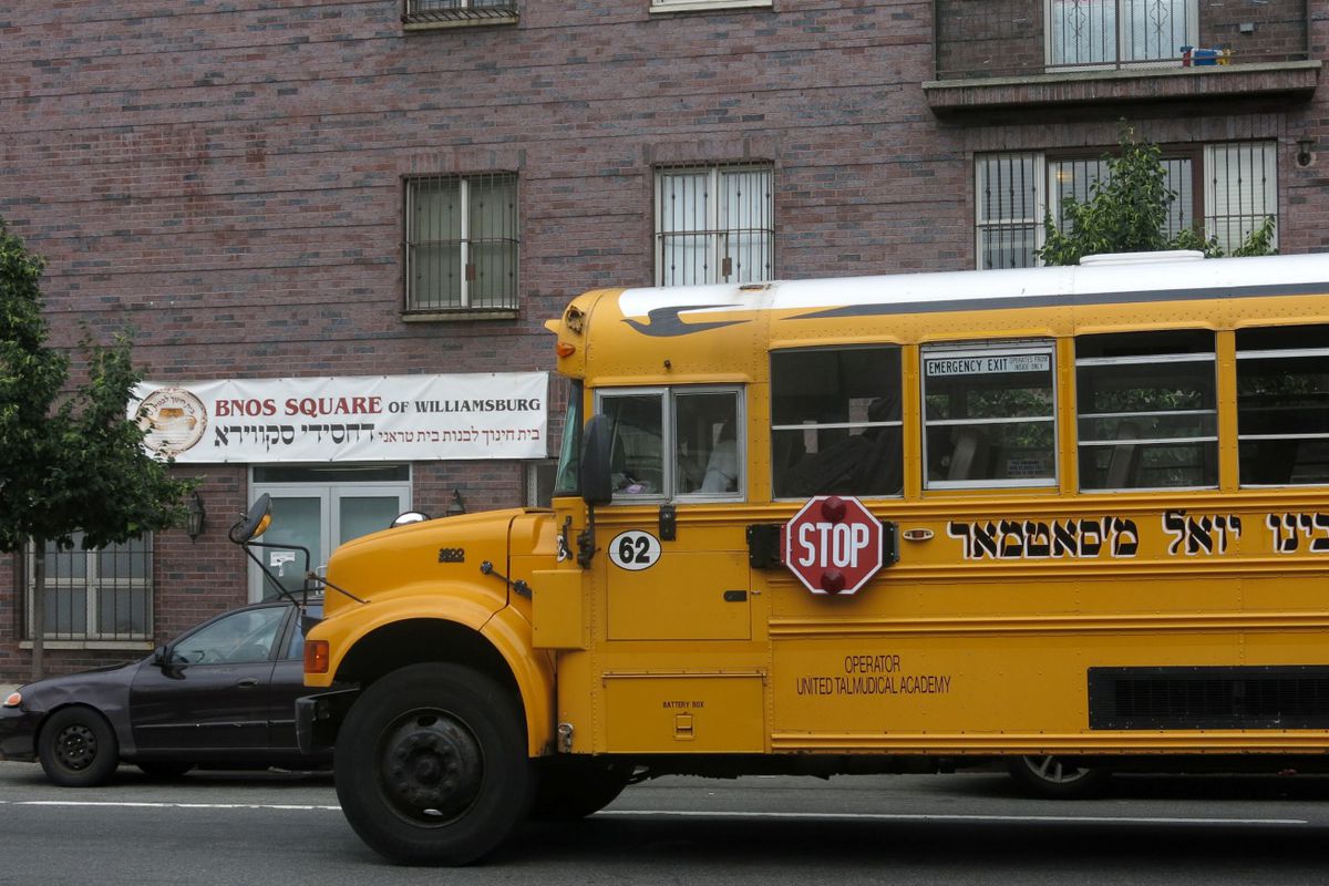 A school bus sits outside an all girls Jewish school in Williamsburg.
