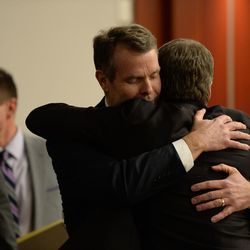 Former Utah Attorney General John Swallow hugs defense attorney Scott C. Williams after he was found not guilty on all charges in his public corruption trial at the Matheson Courthouse in Salt Lake City on Thursday March 2, 2017.