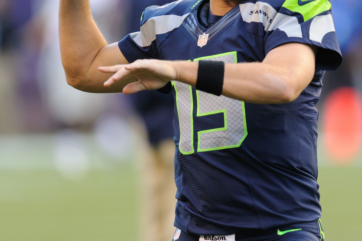 Seattle Seahawks quarterback Matt Flynn (15) warms up prior to the game against the Oakland Raiders at CenturyLink Field.
