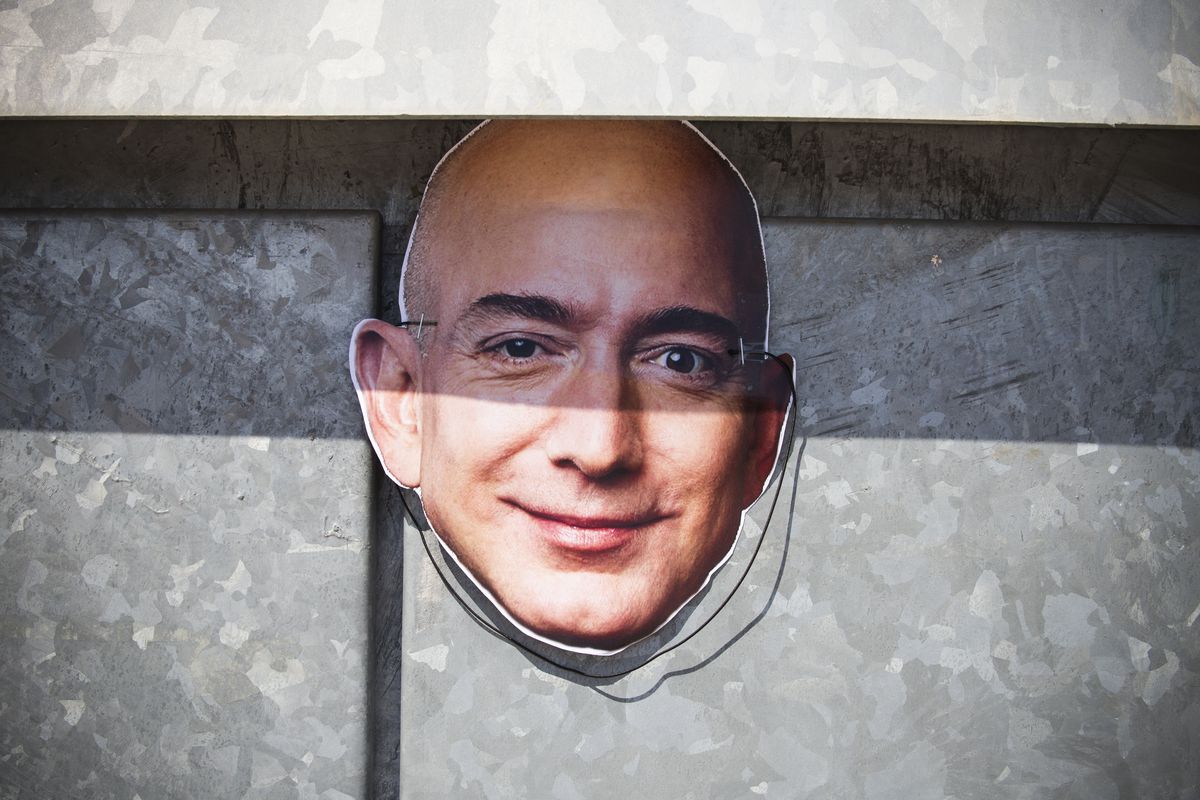 A mask of Amazon CEO Jeff Bezos seen during a three-day strike of “Prime Day” by Amazon employees in San Fernando De Henares, Spain, on July 16, 2018.