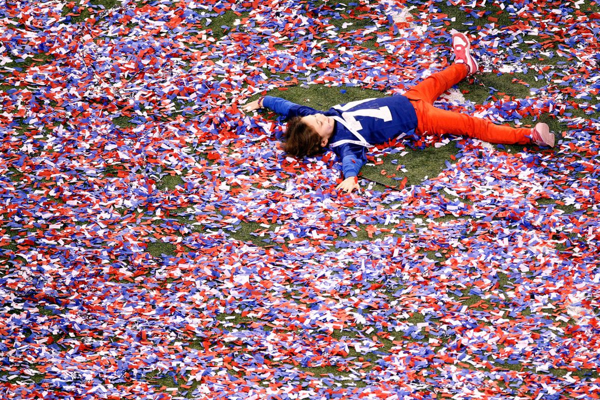INDIANAPOLIS, IN - FEBRUARY 05:  A young fan plays in the confetti after Super Bowl XLVI at Lucas Oil Stadium on February 5, 2012 in Indianapolis, Indiana.  (Photo by Gregory Shamus/Getty Images)