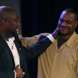 Feb 2, 2013; New Orleans, LA, USA; NFL former player Warren Sapp (left) hugs former player Derrick Brooks after being selected to the pro football hall of fame during a NFL Network presentation at the New Orleans Convention Center. Mandatory Credit: Rober