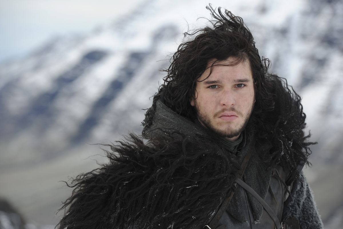 jon snow (kit harington) stares directly into camera in his big wooly black coat