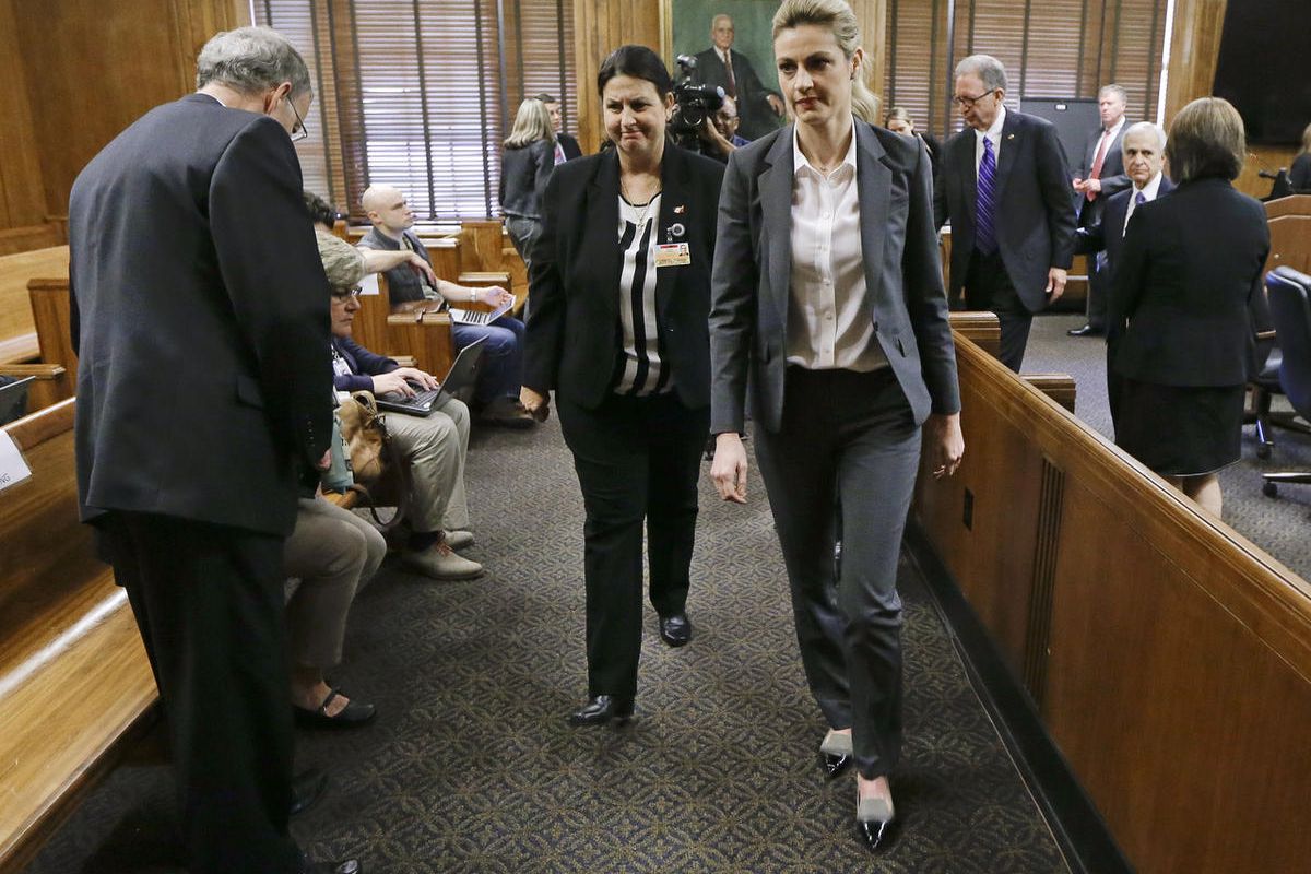 Sportscaster and television host Erin Andrews, center, leaves the courtroom after her lawsuit was given over to the jury Monday, March 7, 2016, in Nashville, Tenn. Andrews has filed a $75 million lawsuit against the franchise owner and manager of a luxury