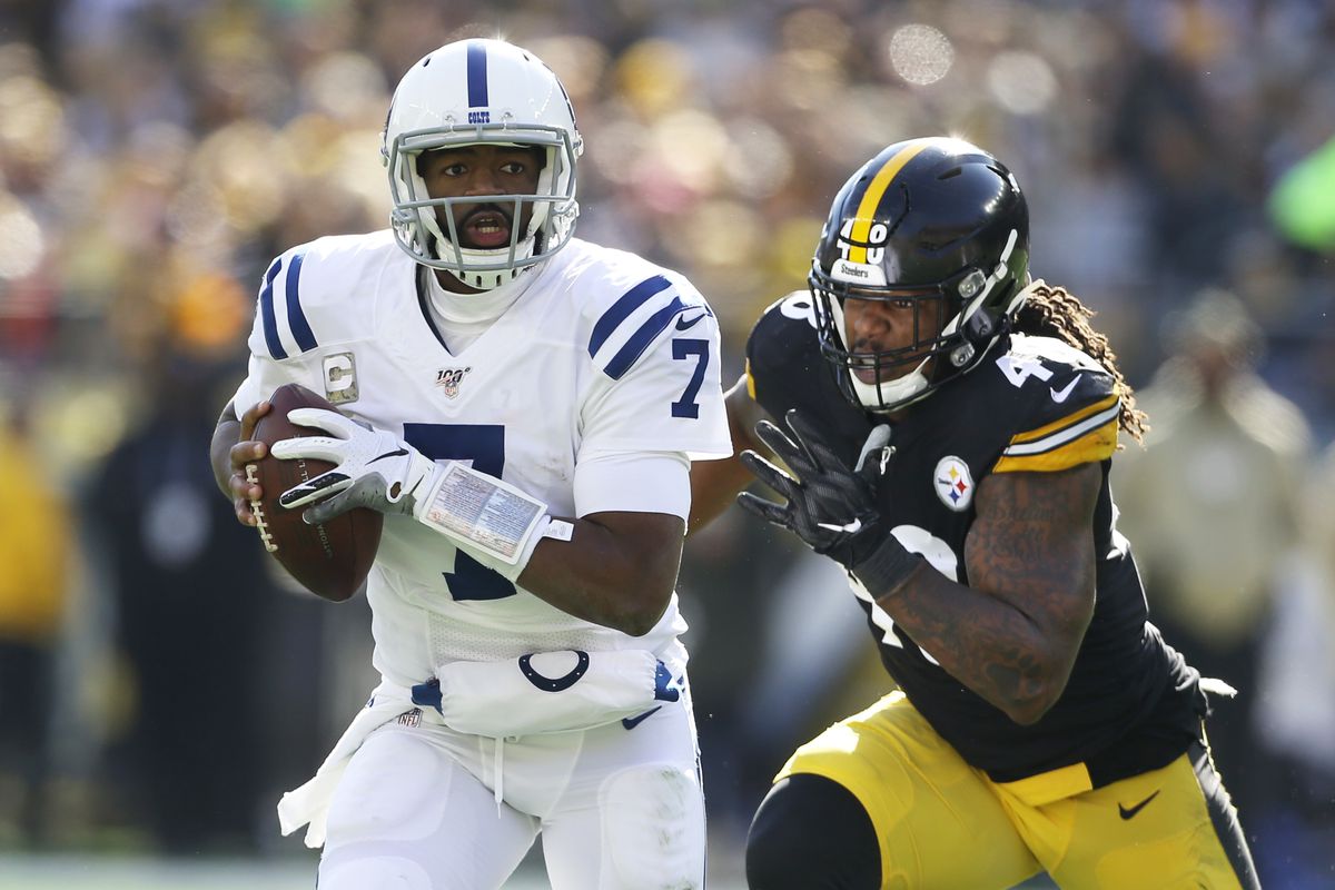 Indianapolis Colts quarterback Jacoby Brissett runs with the ball as Pittsburgh Steelers outside linebacker Bud Dupree chases during the first quarter at Heinz Field.&nbsp;