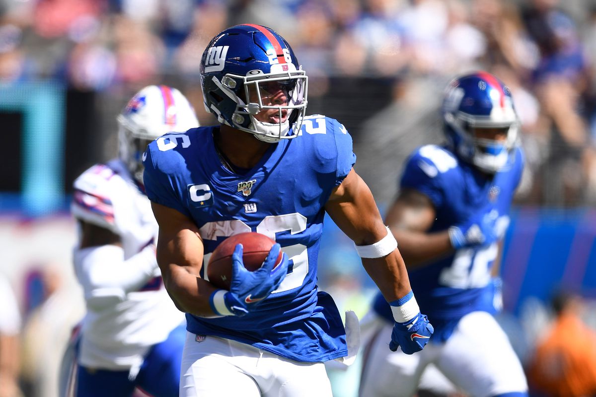 Saquon Barkley #26 of the New York Giants carries the ball for a touchdown during the first quarter of the game against the Buffalo Bills at MetLife Stadium on September 15, 2019 in East Rutherford, New Jersey.