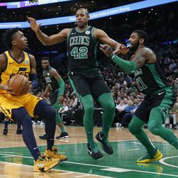 Utah Jazz's Donovan Mitchell (45) looks to shoot against Boston Celtics' Al Horford (42) and Kyrie Irving (11) during the first half on an NBA basketball game in Boston, Saturday, Nov. 17, 2018. (AP Photo/Michael Dwyer)