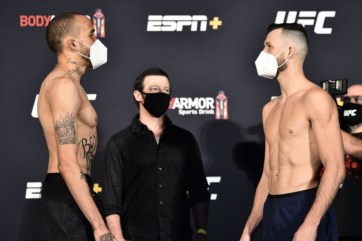 Opponents Sean Woodson and Julian Erosa face off during the UFC weigh-in at UFC APEX on June 26, 2020 in Las Vegas, Nevada.