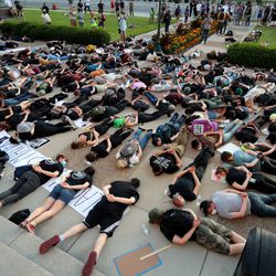 Protesters lie on their stomachs for 8 minutes and 46 seconds as they gather in Provo on Wednesday, July 1, 2020.