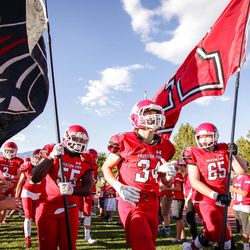The American Fork High School football team takes the field  as Timpview High School takes on American Fork High School at American Fork High in high school football action in American Fork, Utah on Friday, Aug. 25, 2017.