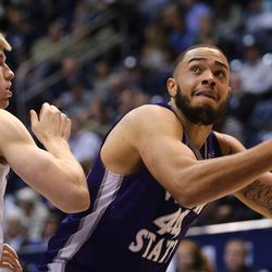 Weber State Wildcats forward Zach Braxton (44) works against Brigham Young Cougars forward Eric Mika (12) under the basket as BYU and Weber State play at the Marriott Center in Provo on Wednesday, Dec. 7, 2016.
