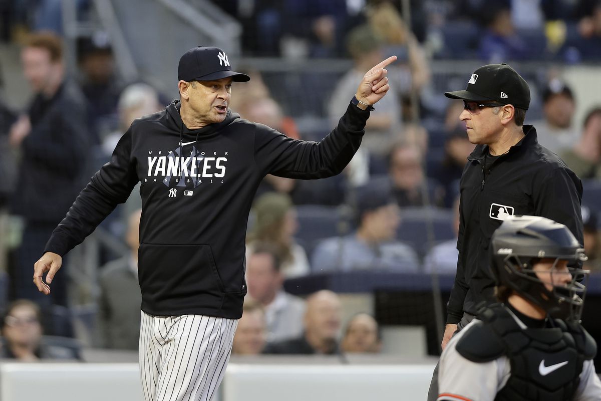 Aaron Boone argues with umpire Chris Guccione on May 25, after his third ejection in 10 games.