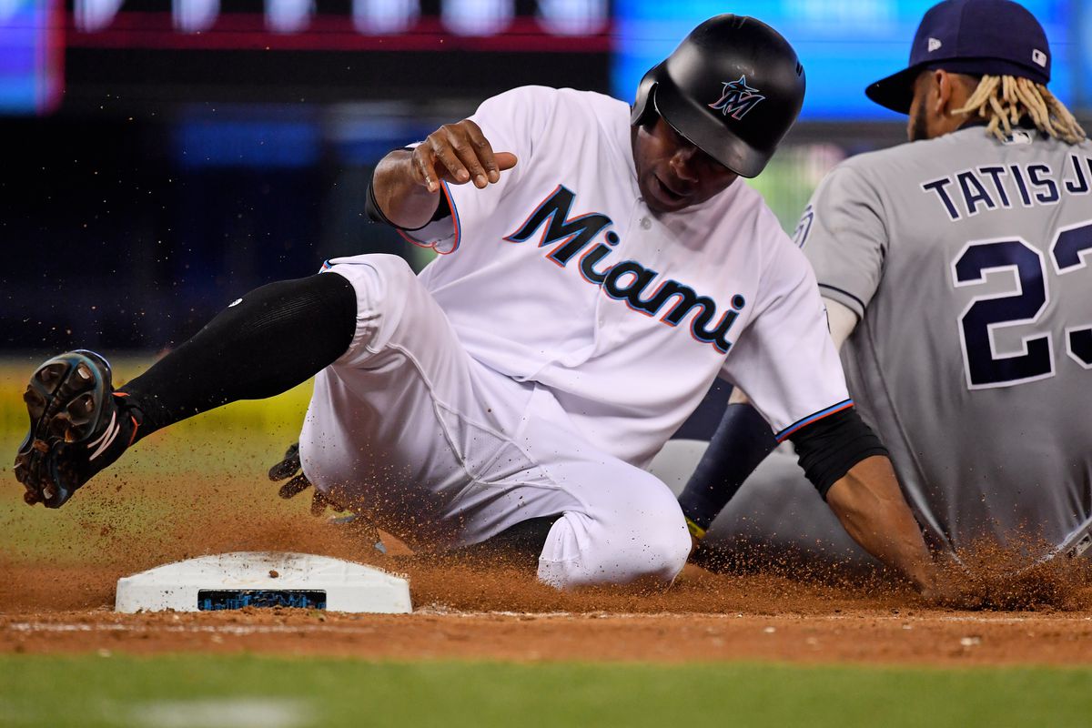 San Diego Padres shortstop Fernando Tatis Jr. (23) tags Miami Marlins left fielder Curtis Granderson (21) for an out in the eighth inning at Marlins Park.&nbsp;