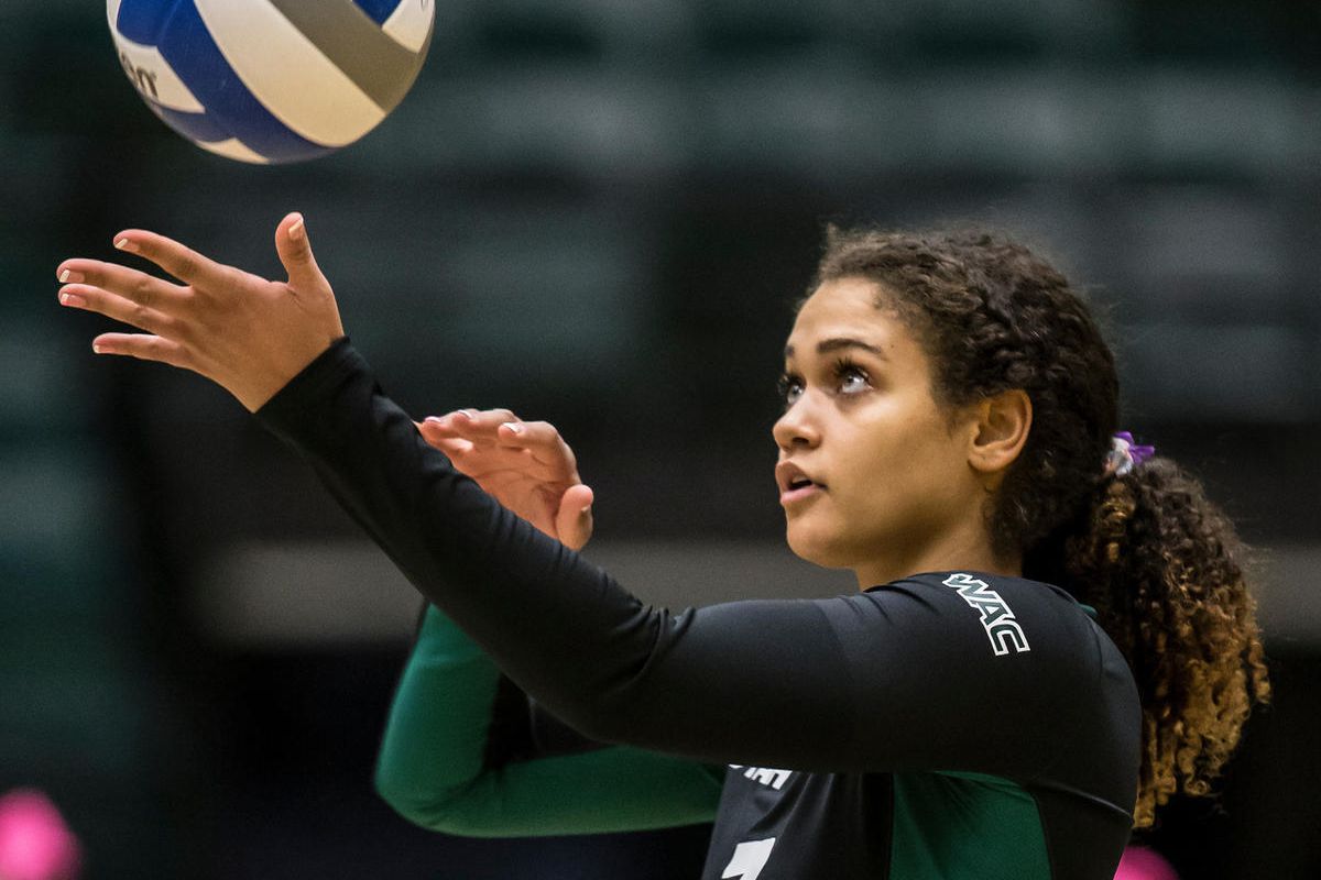 Utah Valley senior libero Nakisha Willden gets ready to serve in a home match versus New Mexico State on Oct. 20. Willden is one of three seniors who will be honored prior to Thursday's match for Utah Valley's Senior Night.