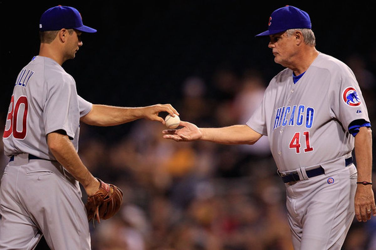 PITTSBURGH - JUNE 01:  Ted Lilly #30 is relieved by manager Lou Piniella #41 of the Chicago Cubs during the game against the Pittsburgh Pirates on June 1, 2010 at PNC Park in Pittsburgh, Pennsylvania.  (Photo by Jared Wickerham/Getty Images)
