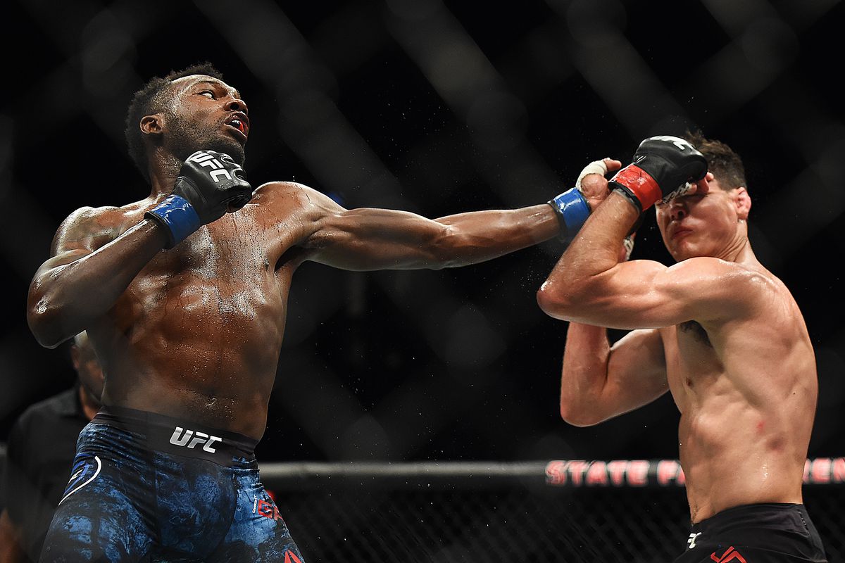 Dwight Grant punches Alan Jouban during the UFC 236 event at State Farm Arena on April 13, 2019 in Atlanta, Georgia.