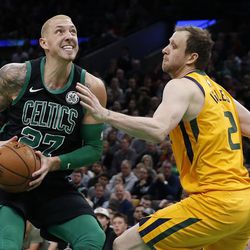Boston Celtics' Daniel Theis (27) looks to shoot against Utah Jazz's Joe Ingles (2) during the second half on an NBA basketball game in Boston, Saturday, Nov. 17, 2018. (AP Photo/Michael Dwyer)