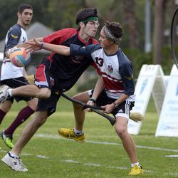 Silicon Valley Skrewts' Logan Anbinder, center, drives to the goal between the University of Ottawa Quidditch team's Matthew Bunn, right, and Ahmed Al-Slaq during a scrimmage at the Quidditch World Cup in Kissimmee, Fla., Friday, April 12, 2013.  Quidditch is a game born within the pages of Harry Potter novels, but in recent years it's become a real-life sport.  The game is a co-ed, full contact sport that combines elements of rugby, dodgeball and Olympic handball. 