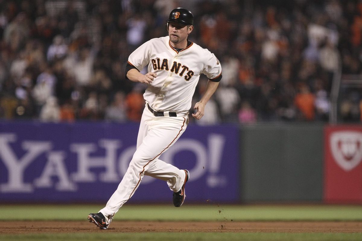 San Francisco, CA, USA; San Francisco Giants first baseman Aubrey Huff (17) runs for a score against the Colorado Rockies during the seventh inning at AT&T Park. Mandatory Credit: Kelley L Cox-US PRESSWIRE