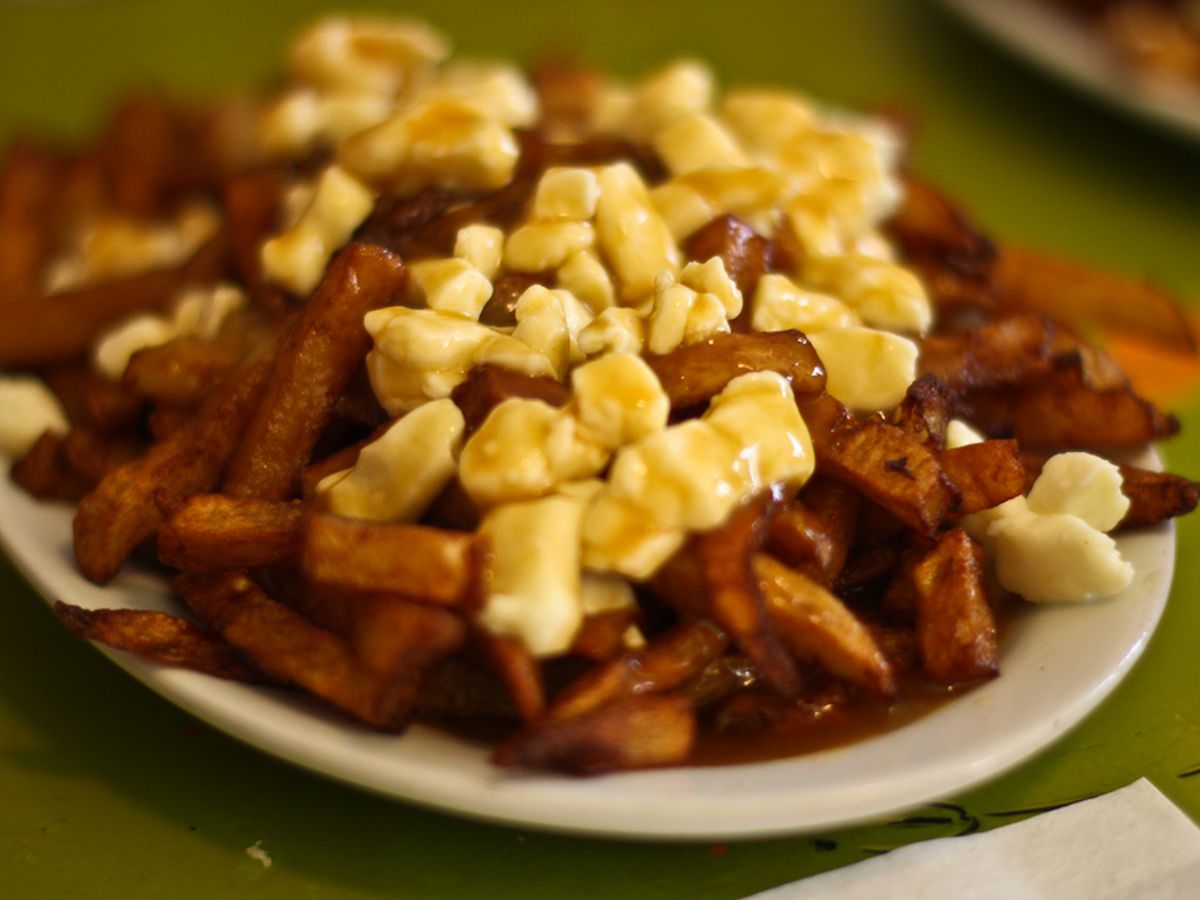 Poutine: French fries topped with cheese curds and slathered in gravy.